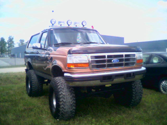 1995 Ford Bronco Eddie Bauer, 3q-front view, lifted with flame decals