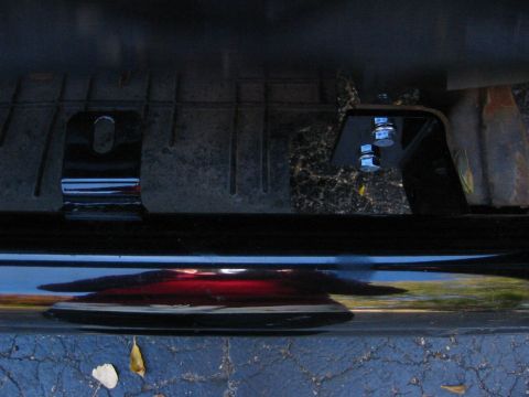 1996 Ford Bronco - Undercarriage view showing mounting hardware attached to the frame.