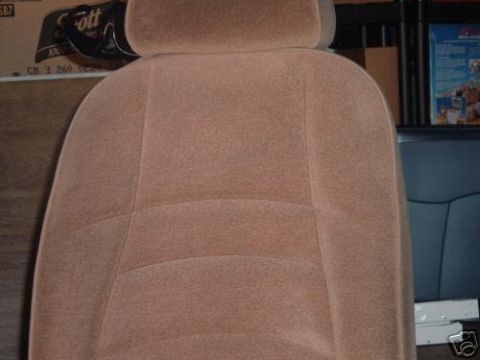 1991 Ford Bronco - Interior view of a tan cloth car seat with a headrest.