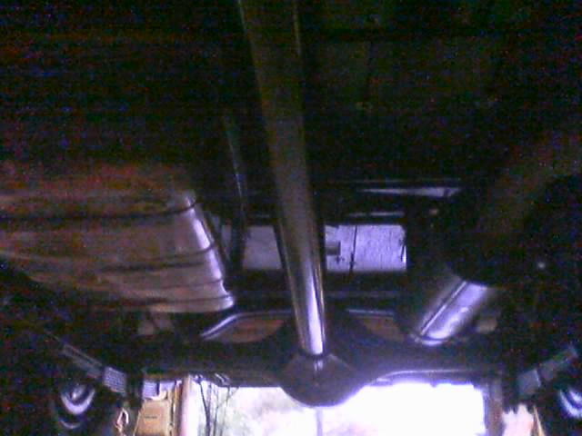 Underside view of a vehicle's exhaust and rear axle assembly