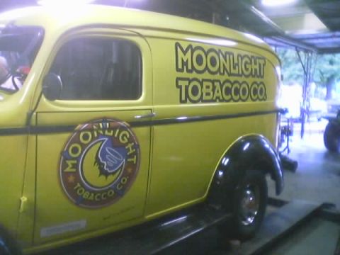 1968 Ford Mustang - Yellow van with "MOONLIGHT TOBACCO CO." text and logo visible on its side.