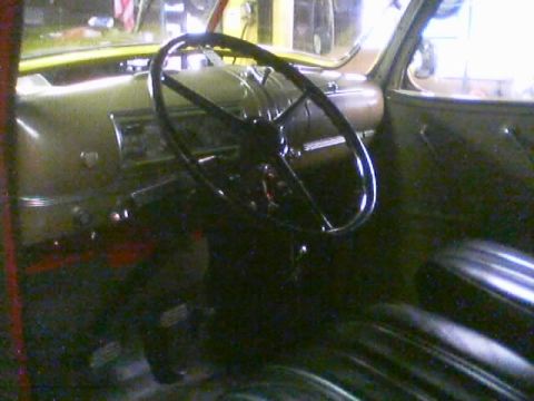 1968 Ford Mustang - Interior view of a vehicle, showing the steering wheel, dashboard, and seats.