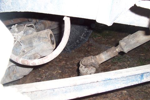 1987 Ford Bronco - Undercarriage view of a vehicle's drivetrain components, including the driveshaft and differential.