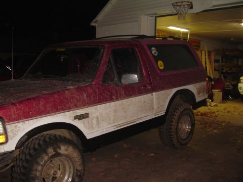 1994 Ford Bronco - This 1994 Ford Bronco has a two-tone red and white paint scheme and appears to be lifted.