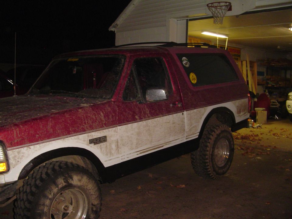 1994 Ford Bronco, red and white two-tone paint, lifted suspension, off-road tires