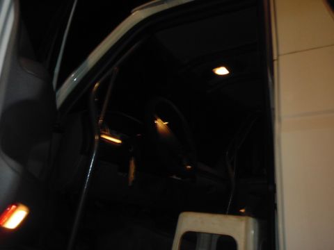 1978 Ford Bronco - Interior shot of a vehicle, focusing on the door frame and ceiling lights.