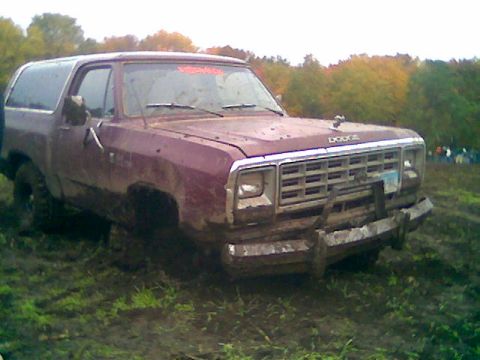 1976 GMC C/K Pickup - This Dodge Ramcharger is stuck in the mud, with a custom wooden front bumper.