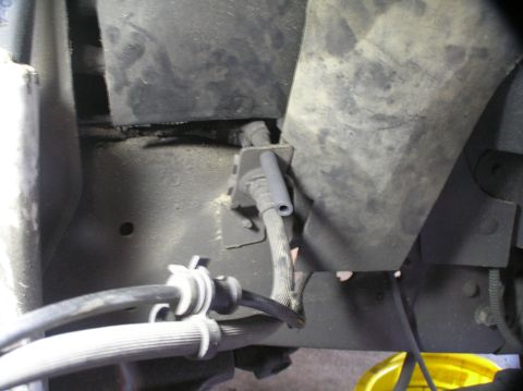 2000 Ford Excursion - Underside view of vehicle brake lines and associated hardware.