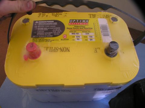 2000 Ford Excursion - A yellow Optima battery is shown, with its "non-spillable" label visible.