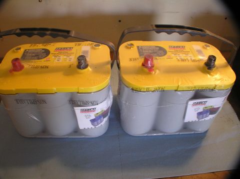 2000 Ford Excursion - Two Optima Yellow-top D34 batteries are shown, each with a black and red terminal.