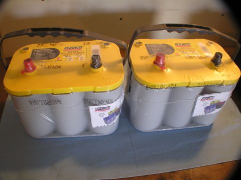 2000 Ford Excursion - Two new Optima Yellow-top D34 batteries are shown, each wrapped in plastic and ready for installation.