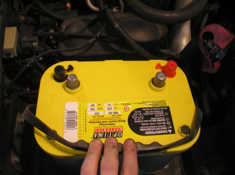 2000 Ford Excursion - Close-up of an Optima Yellow-top D34 battery, showing its label and terminals.