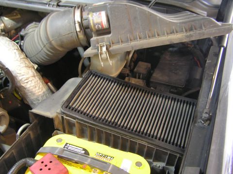 2000 Ford Excursion - Air filter housing and Optima battery visible in the engine bay.