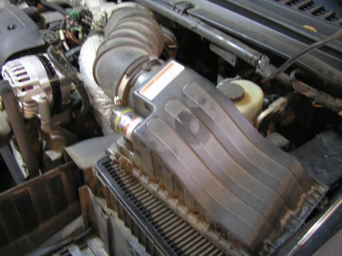 2000 Ford Excursion - Close-up view of the air intake system and engine components.