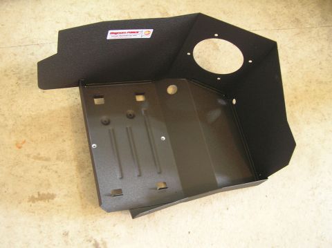 2000 Ford Excursion - A black metal heat shield for an air intake system, a Magnaflow sticker.