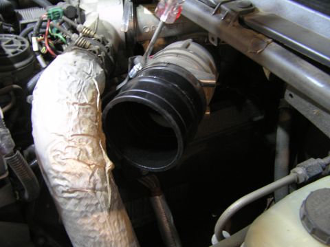 2000 Ford Excursion - Engine intake tube and air filter housing components are visible in this close-up view.