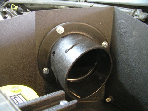 2000 Ford Excursion - This is a close-up view of an engine's air intake system component, likely a filter housing.
