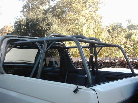 1978 Ford Bronco - This Ford Bronco has a custom roll cage installed, suggesting it's used for off-road or racing purposes.