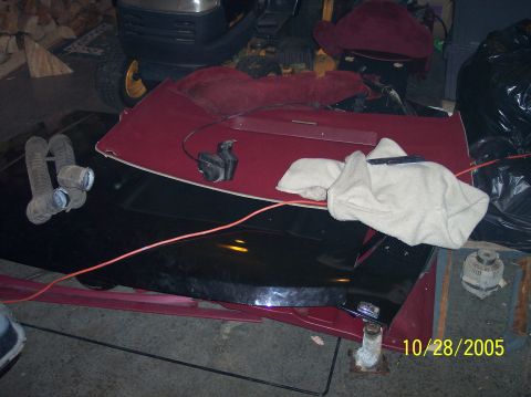 1994 Ford Bronco - A car hood and various parts are laid out on a stand, with a date stamp visible in the corner.