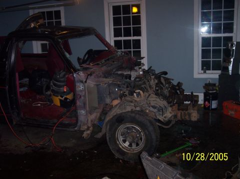 1994 Ford Bronco - This severely damaged truck is missing its front clip and has a broken windshield.