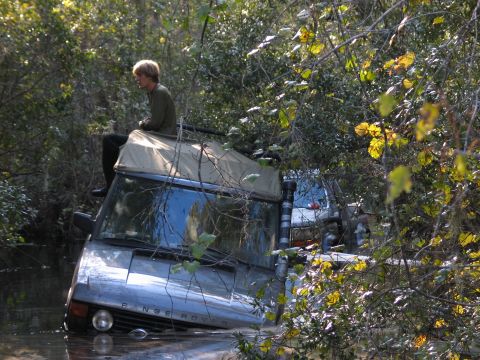 1992 Ford Bronco - see me? pass. head light is halfway under. seats are completely covered