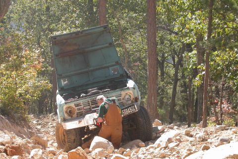 1990 Ford Bronco - Doing some quick electrical connections on the winch so he can get off the hill.