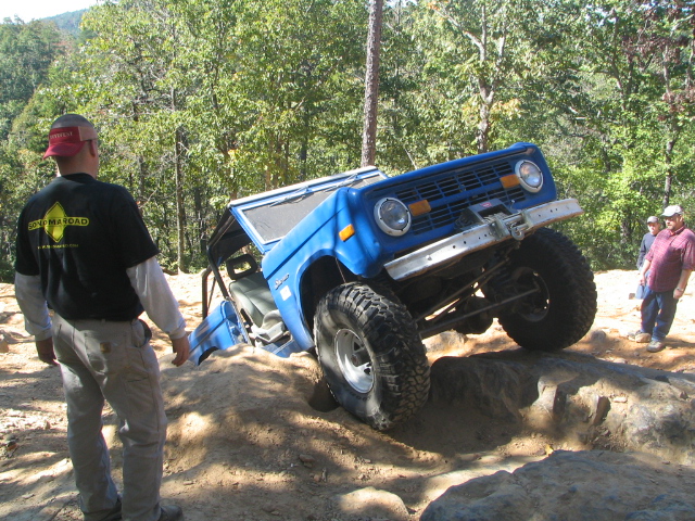 Blue 1978 Ford Bronco climbing rocks