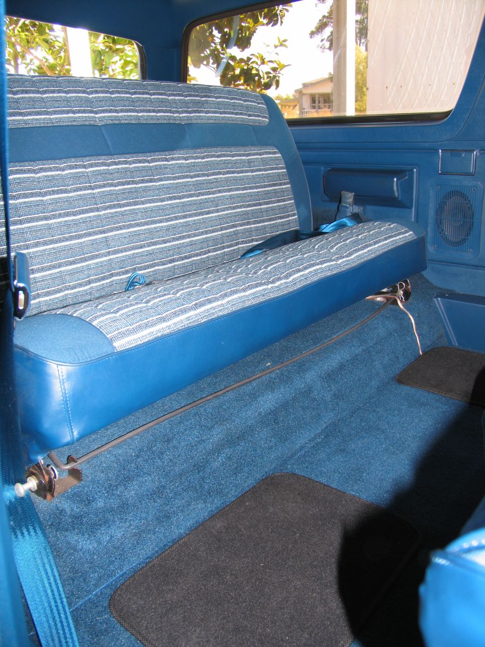 Blue interior with striped rear seat and carpet