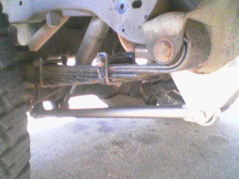 1984 Ford Bronco - Undercarriage view showing leaf springs and part of a tire.