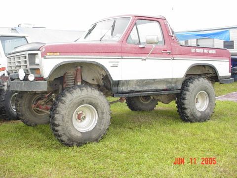 1978 Ford Bronco - This lifted 1978 Ford Bronco features a two-tone red and white paint scheme and aggressive off-road tires.