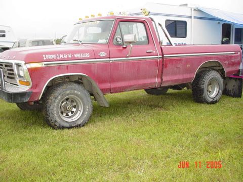 1978 Ford Bronco - A red pickup truck is parked on grass with a camper in the background. The date "JUN 11 2005" is visible.