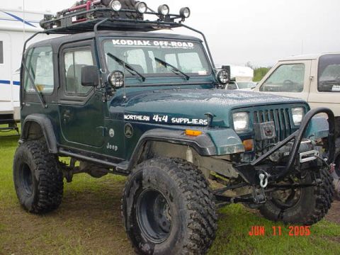 1978 Ford Bronco - Modified Jeep Wrangler parked on grass with another vehicle in the background. Date stamp reads JUN 11 2005.