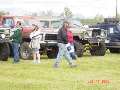 1978 Ford Bronco - Several off-road vehicles are parked on a grassy field, with mountains in the background. The date "JUN 11 2005" is visible.