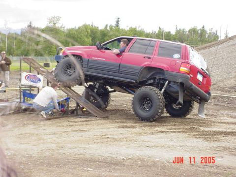 1978 Ford Bronco - A modified Jeep navigates an obstacle course, its off-road capabilities.