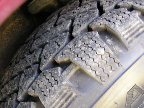 1994 Ford Probe - A close-up view of a tire tread, with the Supermotors.net logo visible on the sidewall.