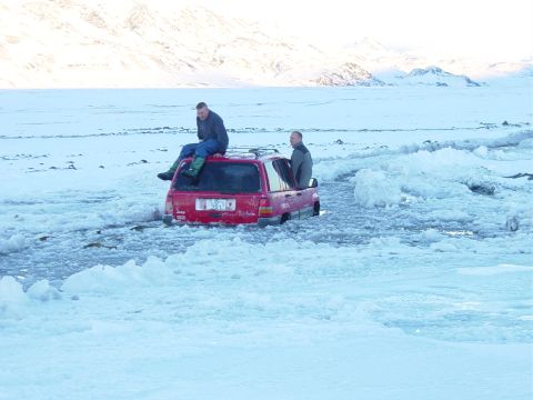 2001 Jeep Wrangler - Two men are stranded with a red Jeep Grand Cherokee stuck in ice and water.