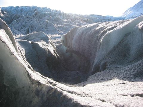 1993 Ford Bronco - Sunlight illuminates textured ice formations on a glacier.