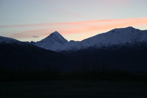 2003 Jeep TJ - The sky shows hues of pink and blue over snow-covered mountains as dusk settles.