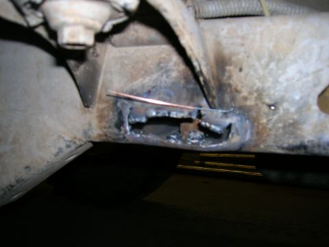 2003 Jeep TJ - This photo shows a section of a vehicle's frame that has been cut open and welded.