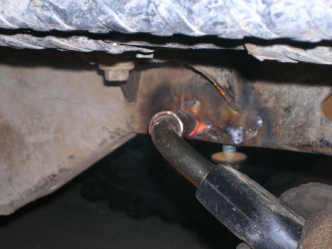 2003 Jeep TJ - Welding a metal frame, likely for vehicle repair or modification.