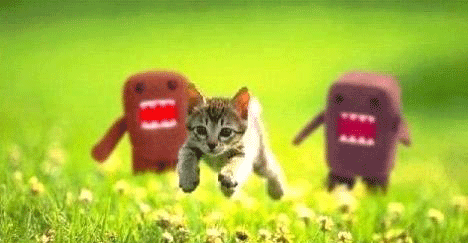 1968 Ford Mustang - A kitten is chased by two Domo-kun figures through a grassy field.