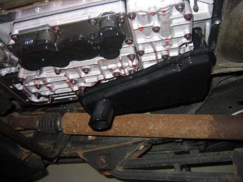 1995 Ford Bronco - The black thing with the spout is the filter it just pulls off. Be ready for more fluid to come out there is about a quart behind it.