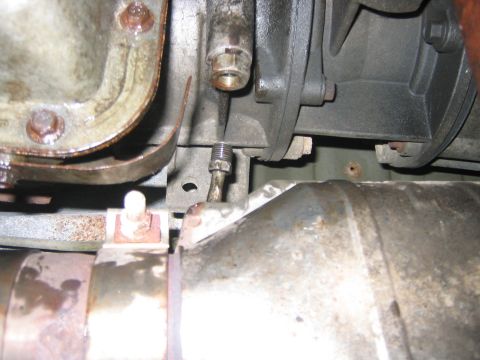 1995 Ford Bronco - With all the fluid out its time to start disconnecting things, like both of the tranny cooler lines. Make sure you only turn the little fit…