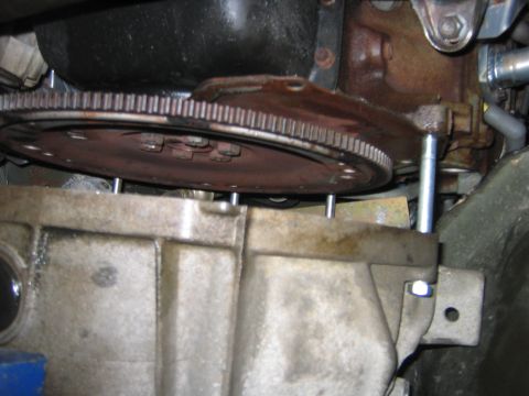 1995 Ford Bronco - Now it wasn’t easy to pull the tranny this far back, I ended up using a ratcheting strap, it was a big ordeal. But now you have access to t…