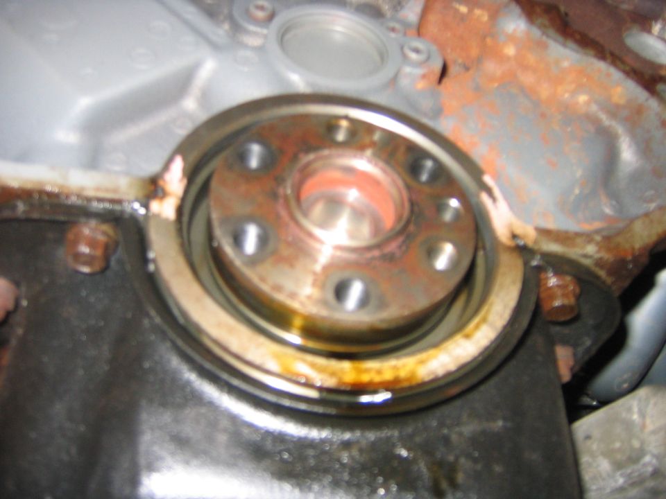 Ok, so now with the tranny out of the way I pried the rear main out with a screw driver easily.  Be careful to not hit the crank (even though I already did.)  But you can get it out with out damaging it.