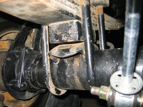 1985 Ford Bronco - Rear axle and leaf spring suspension components are shown in this close-up view.
