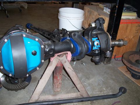 1983 Ford Bronco - A Dana 44 front axle assembly is shown, a bright blue differential cover and new suspension components.