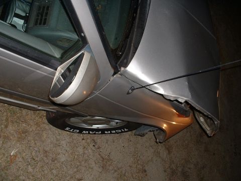 1989 Ford Thunderbird - Car has significant damage to the front fender and side mirror.