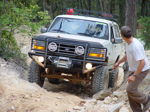 1996 Ford Bronco - White 1996 Ford Bronco tackles a challenging off-road course.