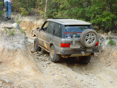 1996 Ford Bronco - This Range Rover is navigating a challenging off-road course.